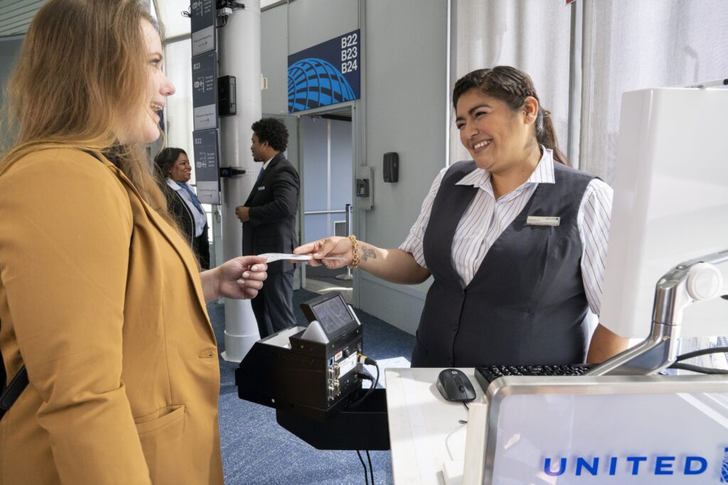 Gate ticketing agent seen with a small tattoo on her right wrist. 