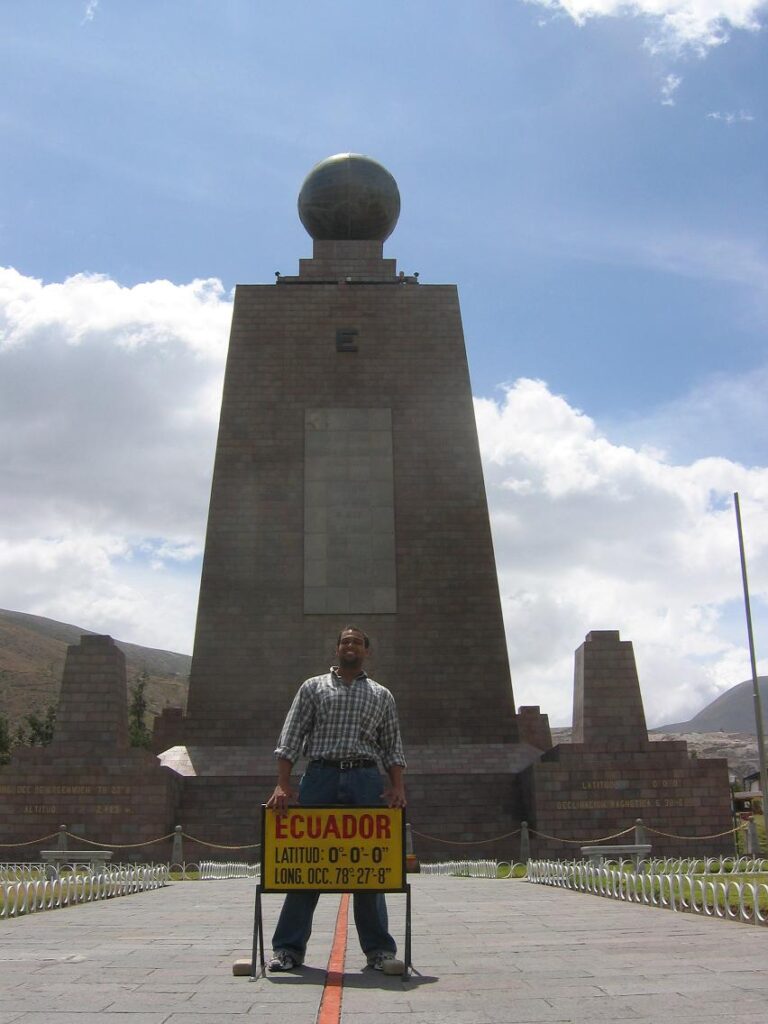 Ernest standing at the equator in Ecuador.
