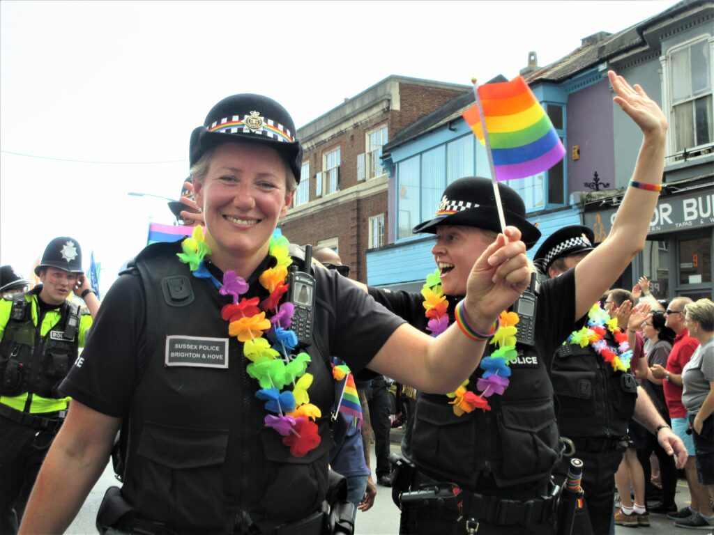 Local police wave rainbow flags at Brighton Pride