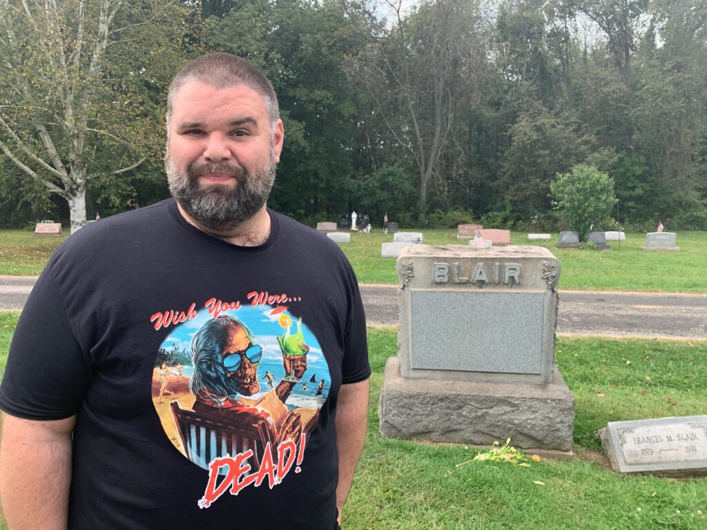 John A. Hernandez stands by the Blair Monument located at the Evans City Cemetery as seen in 'Night of the Living Dead.' 