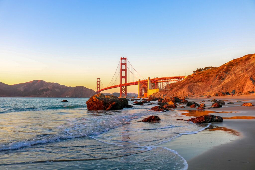 Sandy beach with Golden Gate Bridge in the background