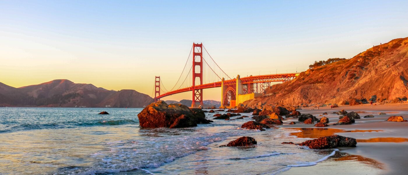 Sandy beach with Golden Gate Bridge in the background