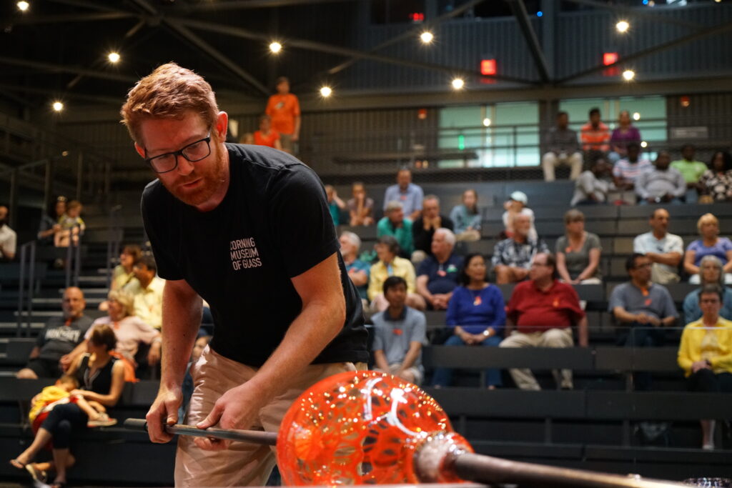 Dane Jack demonstrates his glassblowing skills for an audience at the Corning Museum of Glass. (Photo Credit: Amanda S.)