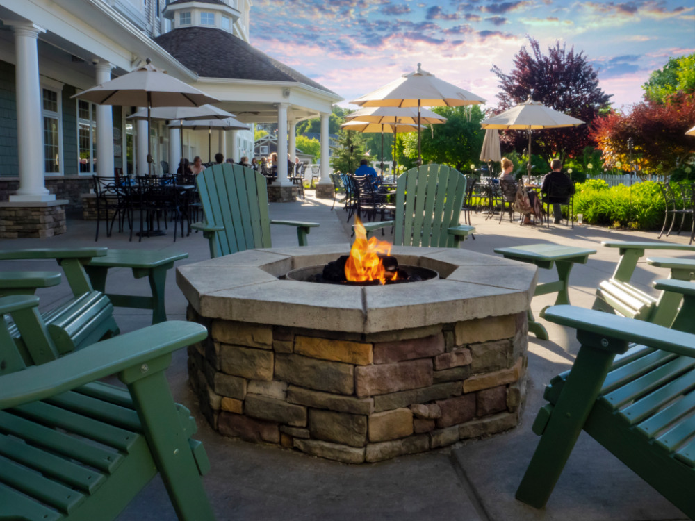 Grab a glass of wine and cozy up next to one of two pits located outside of the hotel. (Photo Credit: Watkins Glen Harbor Hotel)