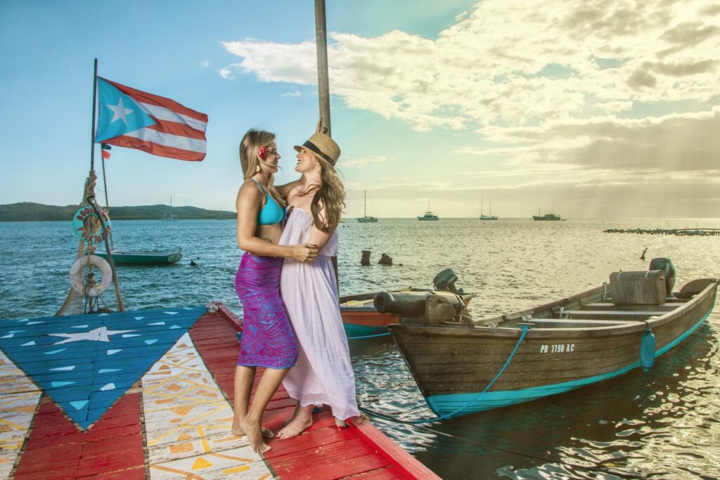 Lesbian couple on a pier in Puerto Rico (Photo Credit: Discover Puerto Rico)