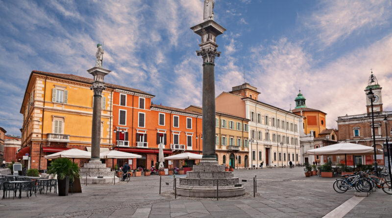 Ravenna, Emilia-Romagna, Italy: the main square Piazza del Popolo with the ancient columns with the statues of Saint Apollinare and Saint Vitale (Photo Credit: iStock)