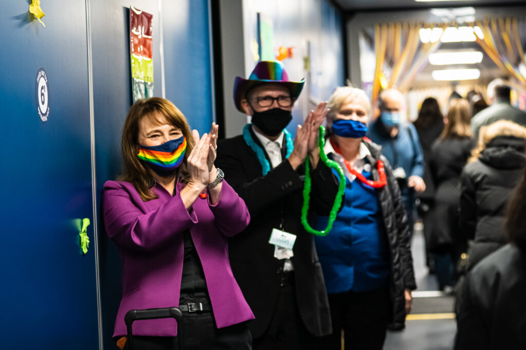 United crew hands out leis to United employees and passengers deplane in Chicago.