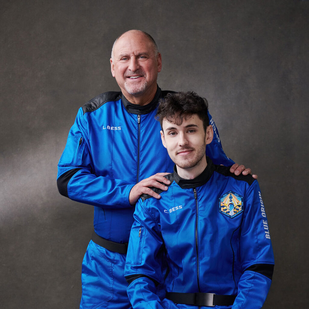 Cameron Bess (seated) and their father, Lane Bess (Photo Credit: Blue Origin)