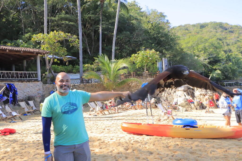 Kwin Mosby with a bird of prey at Las Caletas (Photo Credit: Omar Villalpando)