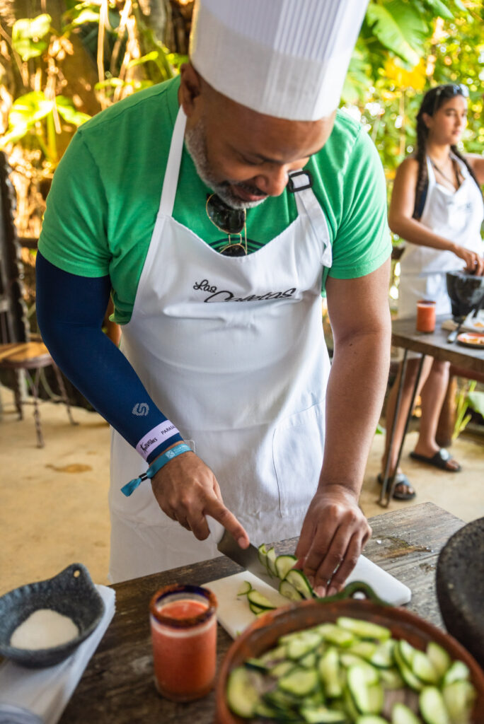 Kwin cutting cucumber in a cooking class at Las Caletas. (Photo Credit: Josh Laskin)