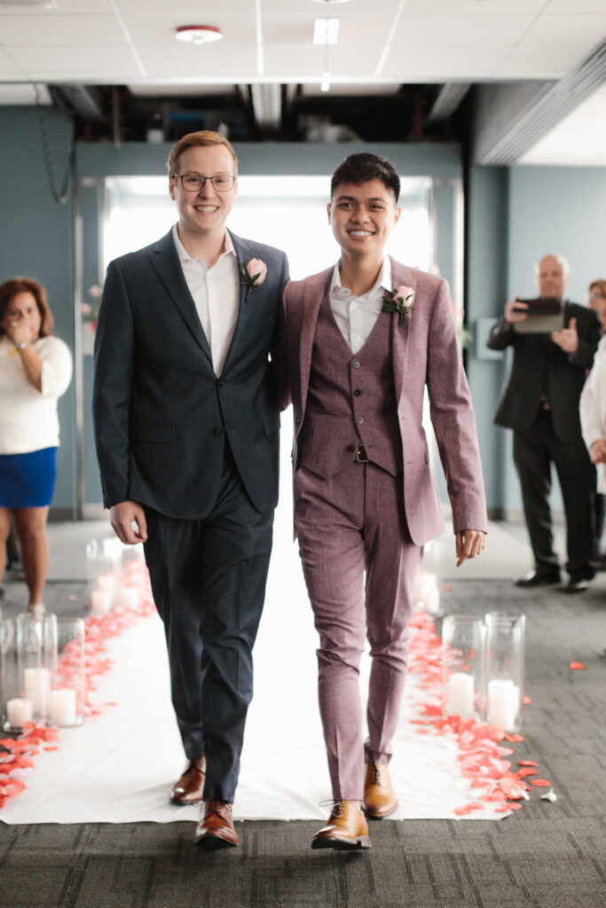 Eric and Carlo after their wedding ceremony on the Ledge at Skydeck Chicago. (Photo Credit: Skydeck Chicago)
