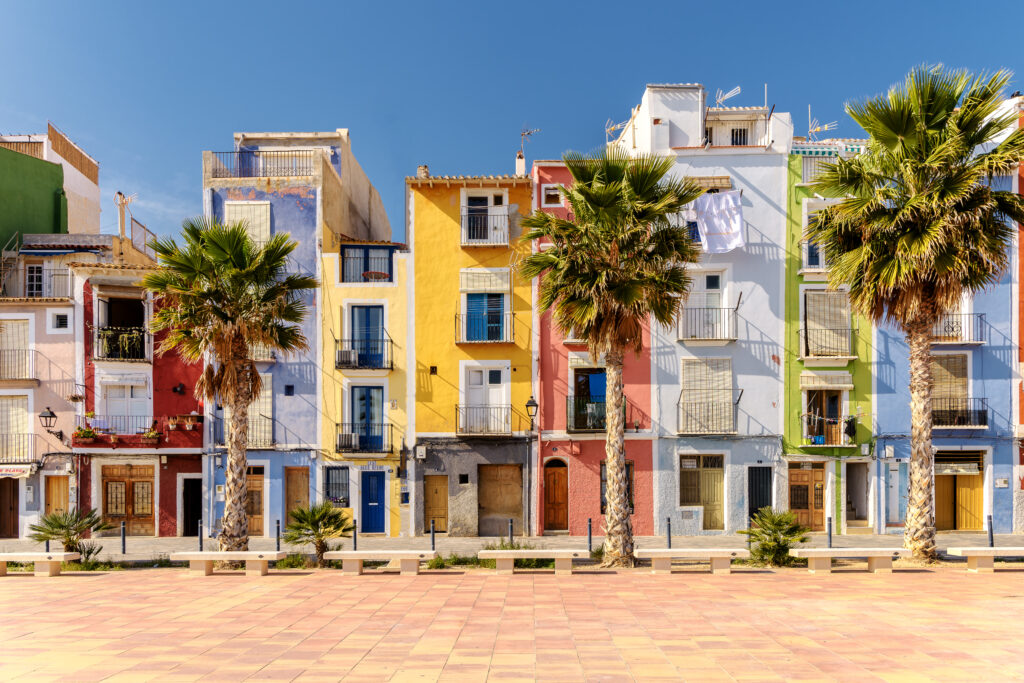 Colorful beach homes in Villajoyosa, a charming Mediterranean village located in Alicante, Southern Spain on Costa Blanca. (Photo Credit: Ed-Ni-Photo / iStock)