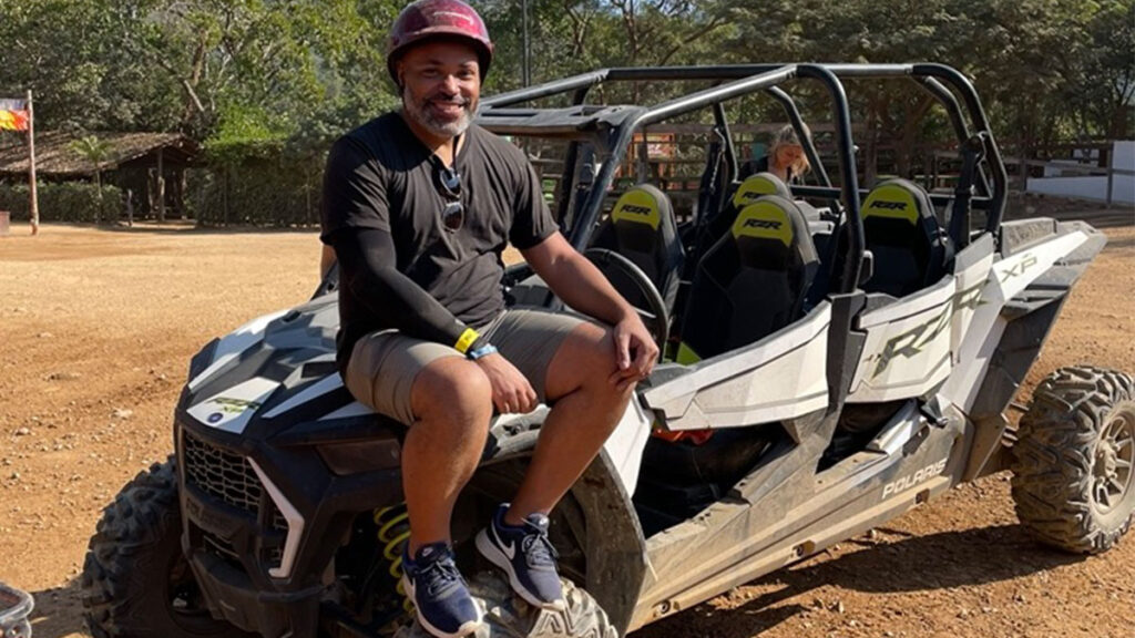 Kwin sitting on RZR after tour at Canopy River Park (Photo Credit: Kwin Mosby)