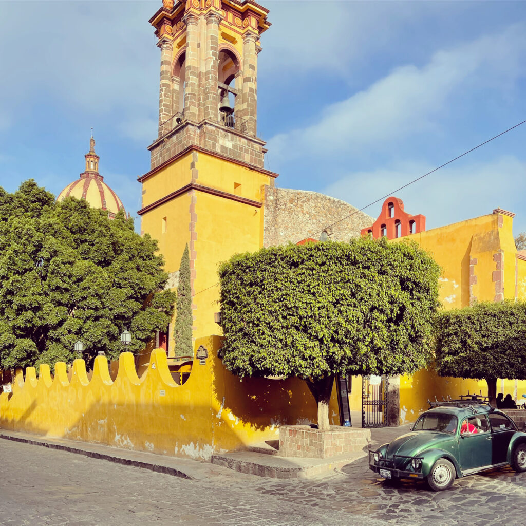 One of the city's many churches and a Volkswagen beetle which is a common sight in San Miguel (Photo Credit: Stephen Ekstrom)