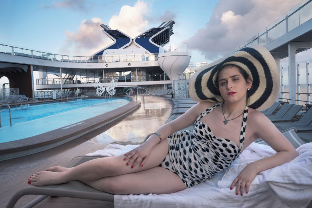 Abby Chava Stein – an American transgender author, activist, blogger, model, speaker, and rabbi – relaxes on the Resort Deck of Celebrity Apex. Abby is the first openly transgender woman raised in a Hasidic community. (Photo Credit: Annie Leibovitz / Celebrity Cruises / AIPP)