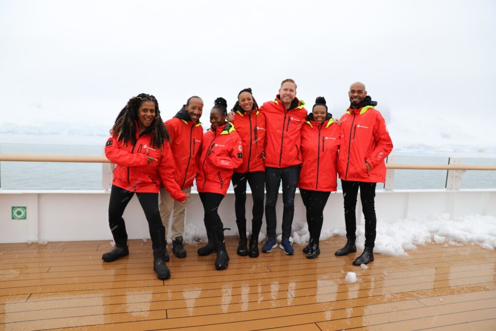 Black Traveler Advisory Board pose for photo with Lindstorm in Antarctica (Photo Credit: Anders Lindström)