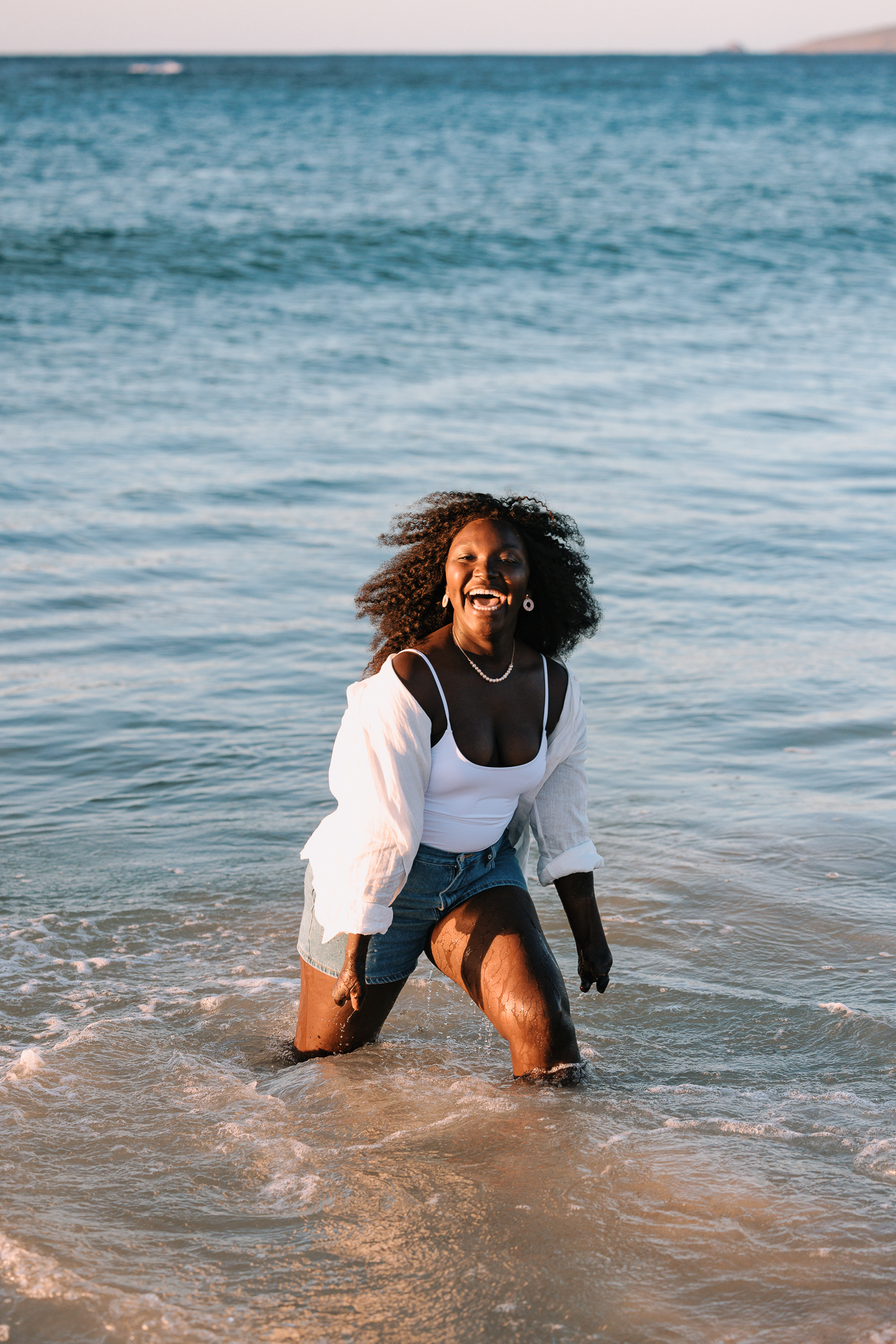 From South Sudan and the Kakuma refugee camp, Esther Onek made her way to Australia, where she is social worker and a people’s rights advocate. She’s seen here playing on the beach. (Photo Credit: Jarrad Seng / Celebrity Cruises / AIPP)