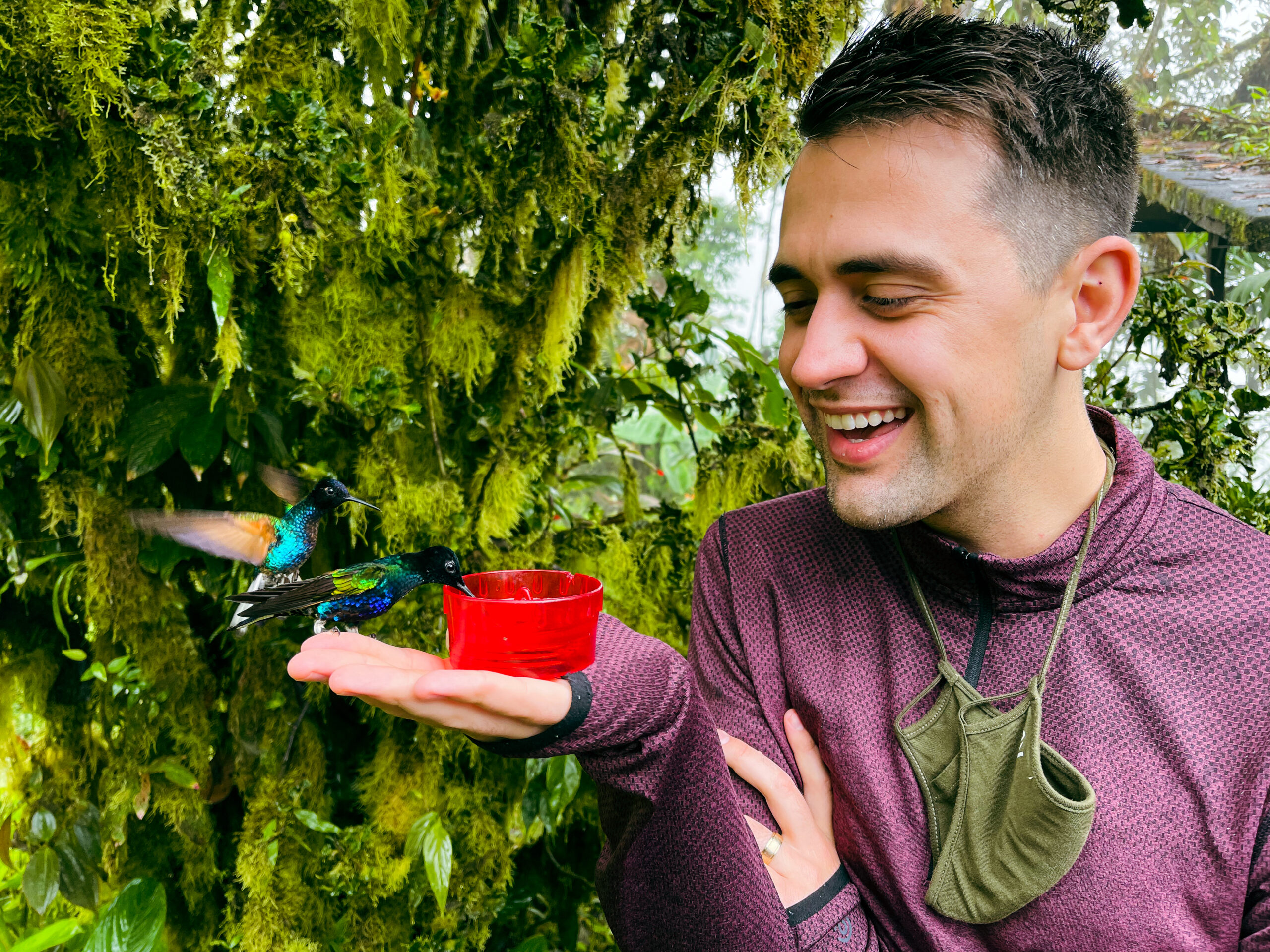 James Wellington feeding hummingbirds at Mashpi Lodge (Photo Credit: Will Jardell and James Wallington)