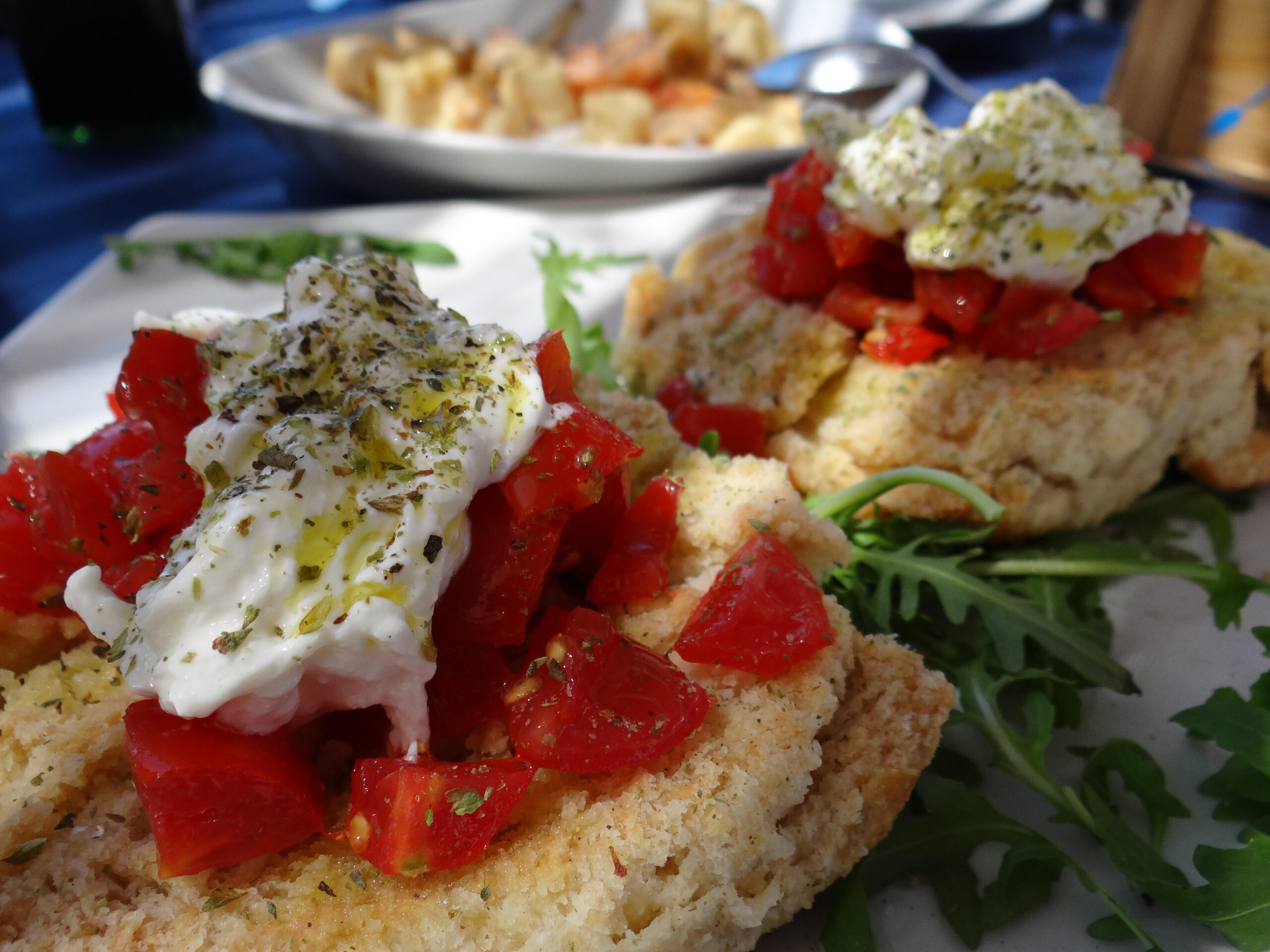 Fresh burrata cheese drizzled in olive oil