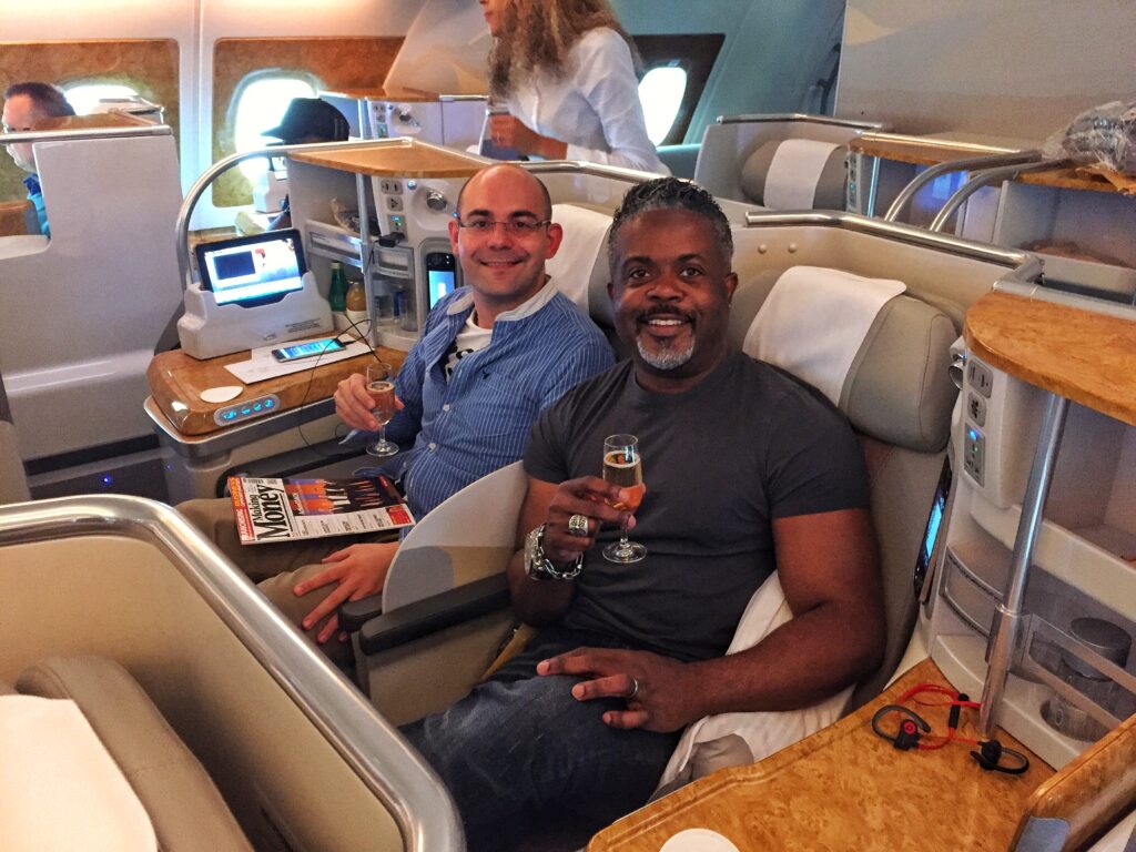 Abraham Bravo and Keith, his husband, on an Emirates plane with his husband, Keith. (Photo Credit: Abraham Bravo)