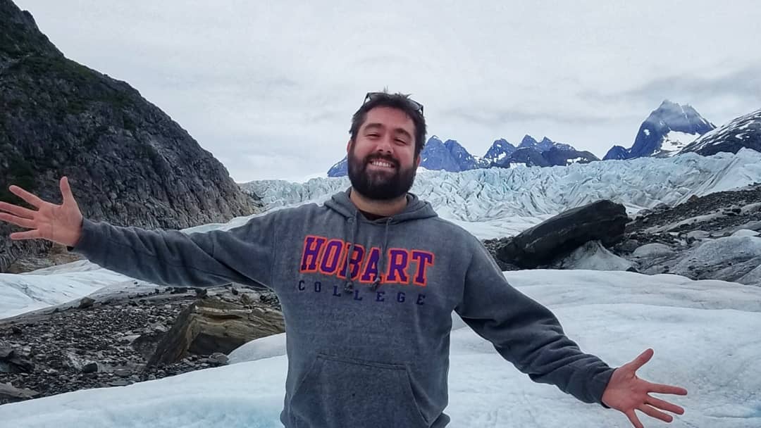 Alex Bryce standing on top of Mendenhall Glacier outside of Juneau, Alaska.