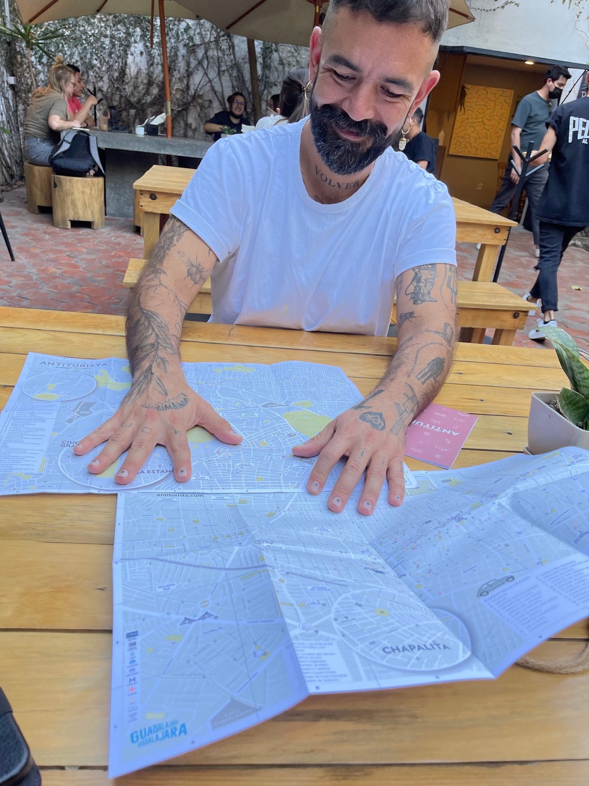 Owner of Peligro al Fondo restaurant, Alex Serratos shows off the local antitouristik or insider's map of Guadalajara. (Photo Credit: Stephen Ekstrom)