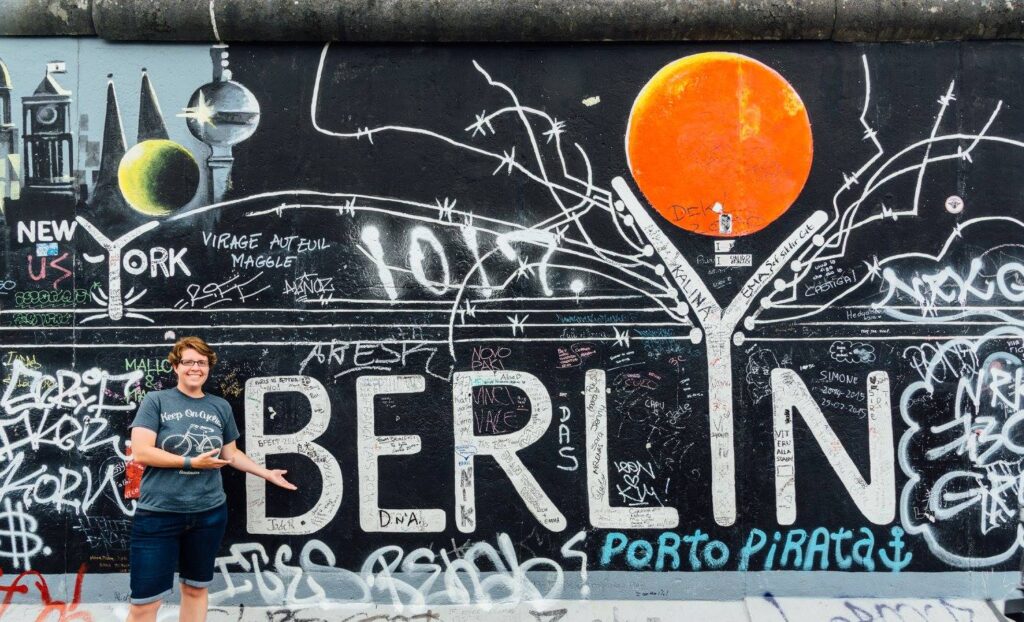 Taryn Peterson in front of the Berlin Wall