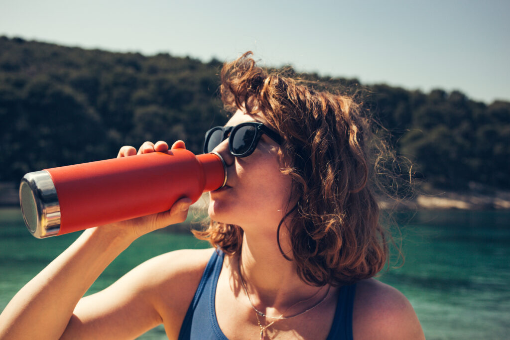 Pack reusable items like a refillable water bottle. (Photo Credit: Anja Ivanovic / Shutterstock)