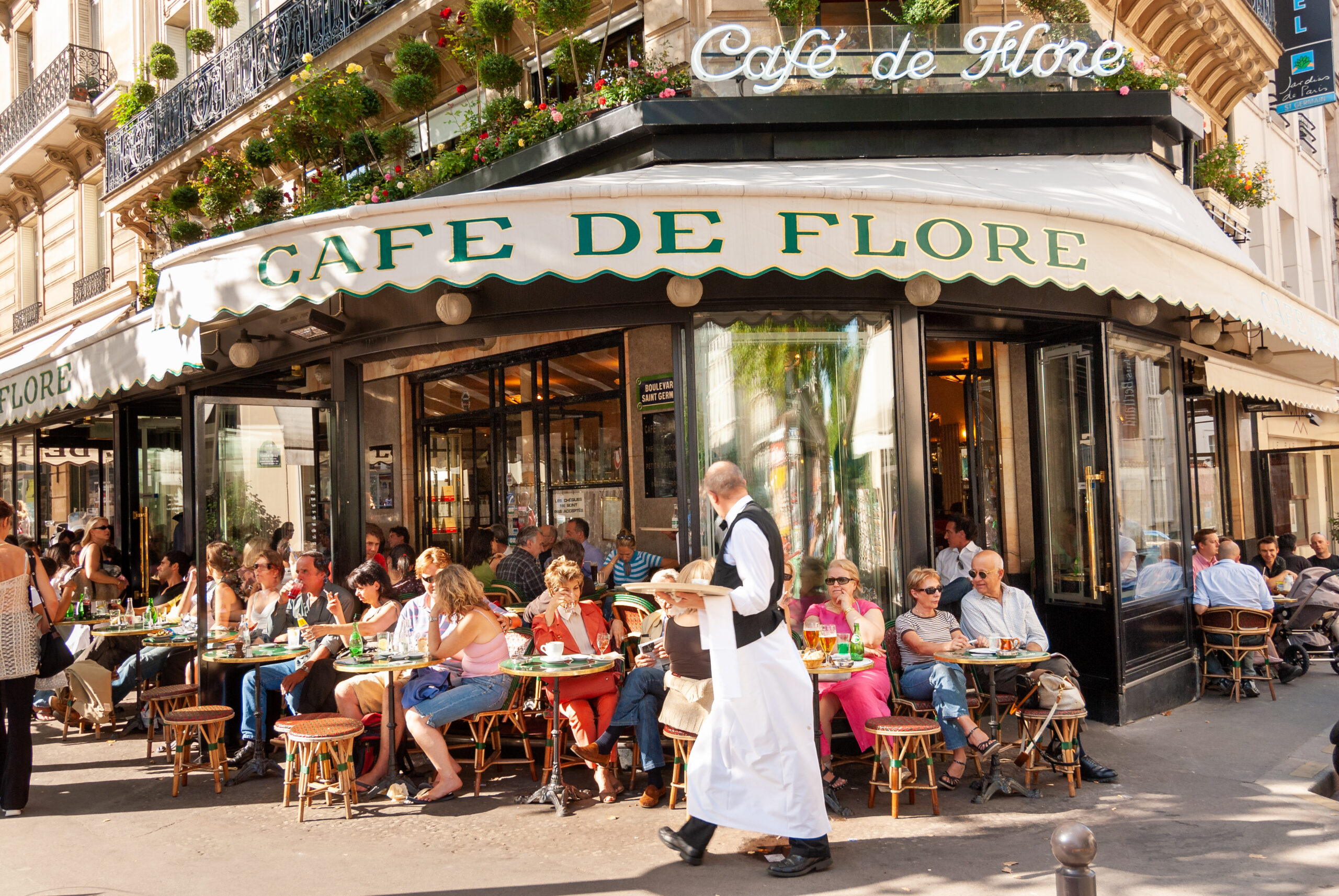 Busy Café Flore in Saint Germain de Prés (Photo Credit: Alex Segre / Shutterstock)