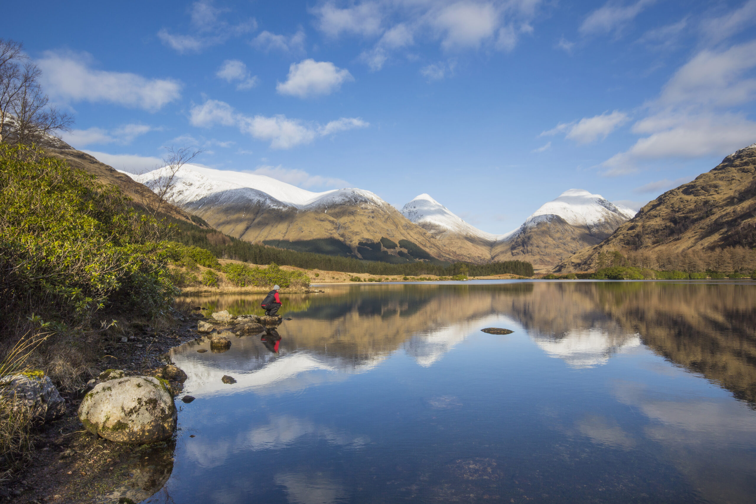 Lochan Urr in Glen Etive with a snow-capped Buachaille Etive Beag and Buachaille Etive Mor in the background (Photo Credit: Visit Scotland)