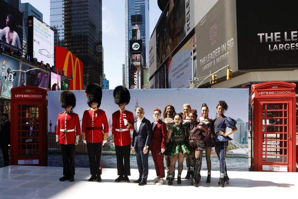 London's Mayor Khan poses with Laura Citron, CEO of London & Partners, the Coldstream Guards and the cast of SIX in New York. (Photo Credit: Jason Decrow/AP Images for London & Partners)