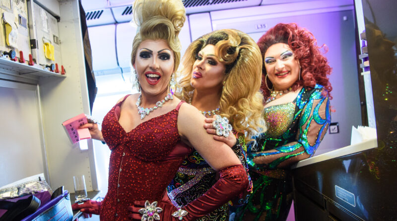 Tess Tickle, Emma Royed and Miss Cara (from left to right) on the Virgin Atlantic plane. (Photo Credit: Matt Crossick/PA Wire)