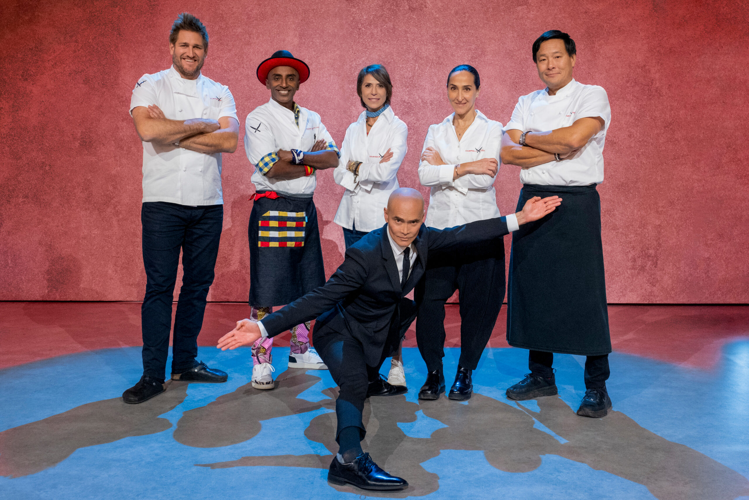 From left to right, Curtis Stone, Marcus Samuelsson, Dominique Crenn, Mark Dacascos, Gabriela Camara, and Ming Tsai on Iron Chef: Quest for an Iron Legend. (Photo Credit: Patrick Wymore/Netflix © 2022)