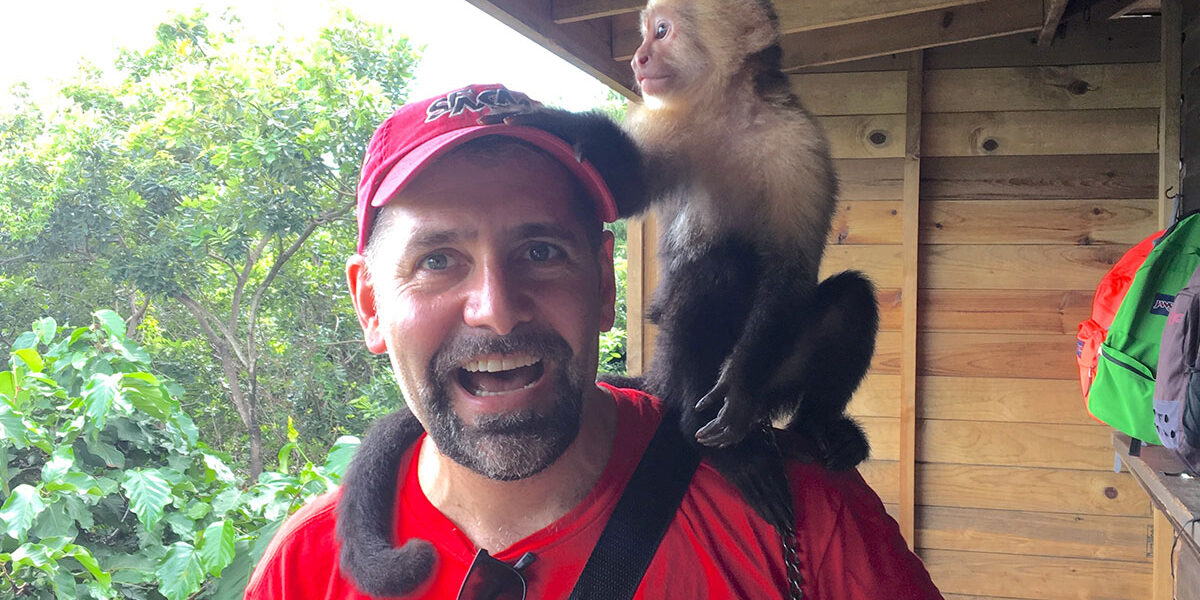 Eric Hope with a new friend on Roatán Island, Honduras (Photo Credit: Eric Hope)
