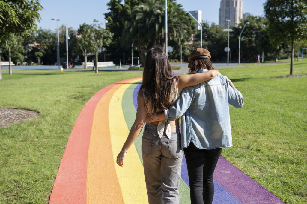 Couple enjoying a walk along the rainbow path in Prince Alfred Park in Surry Hills. (Photo Credit: Destination NSW)