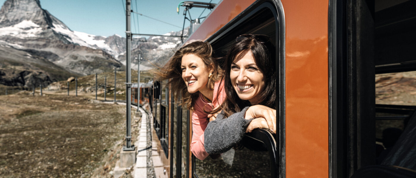 Couple on a Gornergrat Railway train in Switzerland (Photo Credit: Pink Alpine)