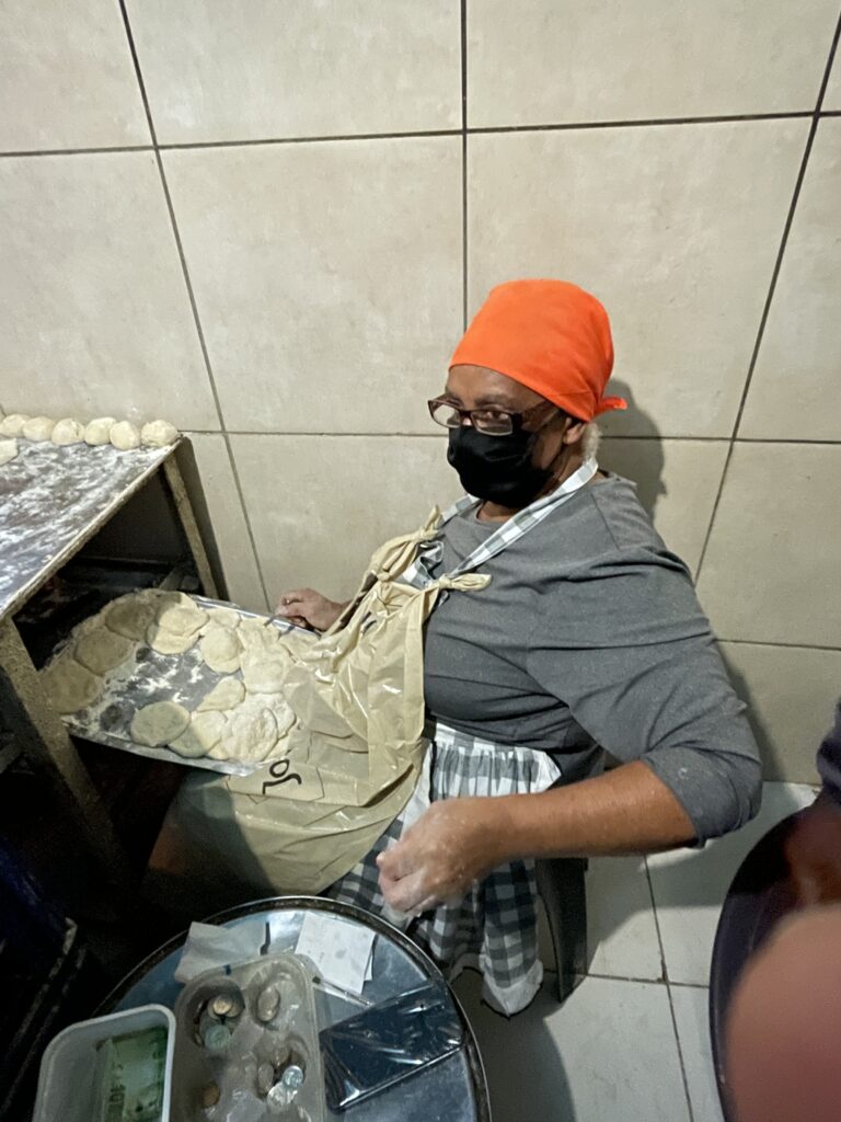 Matriarch of Alexandra Township making fat cakes.