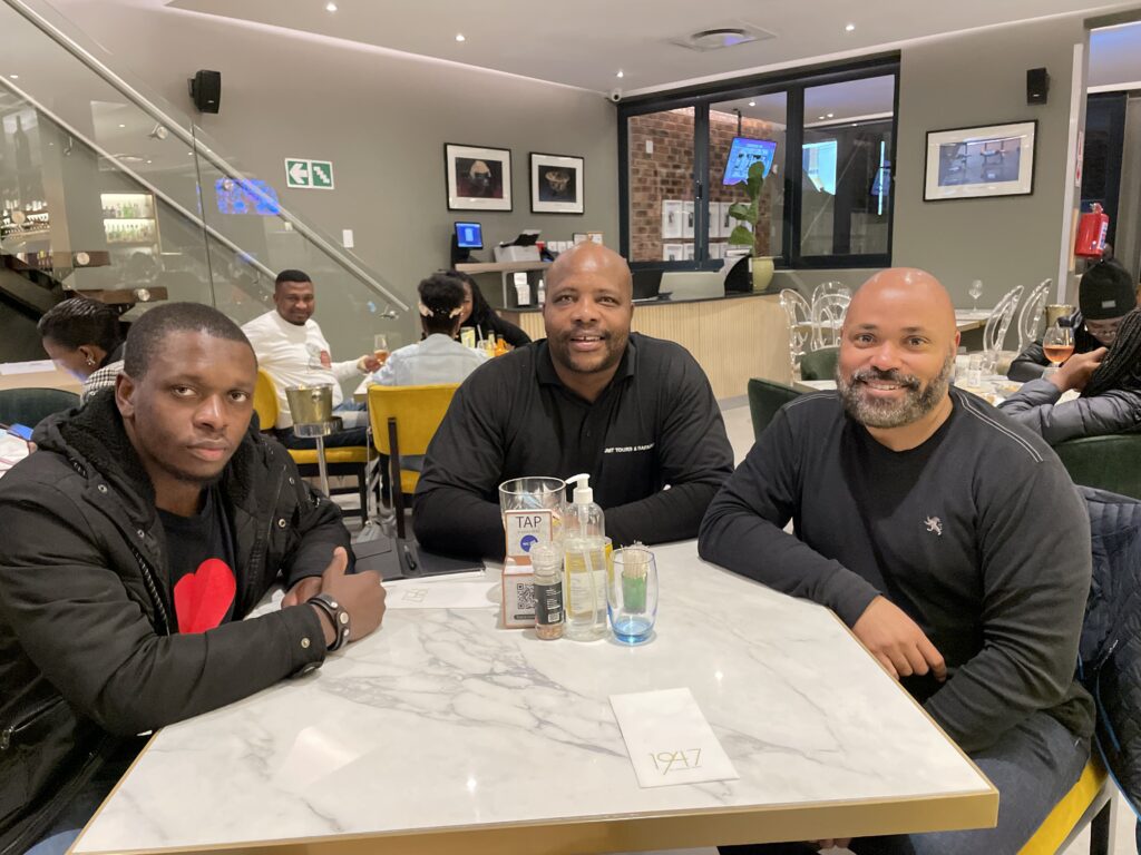 Michael Ndlovu, JT Motsogi, and Kwin Mosby at 1947 Restaurant on Vilakazi Street