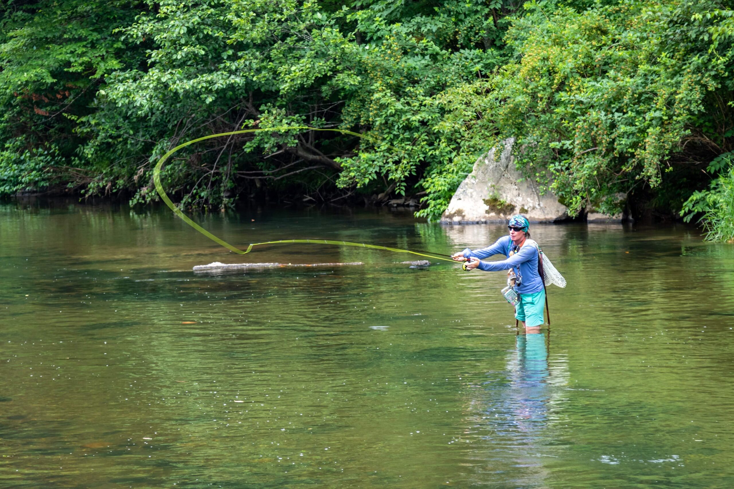 Owner of RiverGirl Fishing Company, Kelly McCoy fly fishing. (Photo Credit: ©Germain Media)