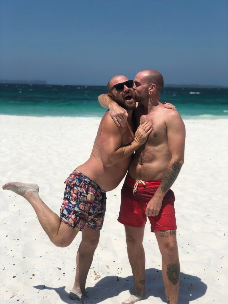 Jason and his partner, Liam Farmer, at Hyams Beach (New South Wales), known for having the 'whitest sands' in the world! (Photo Credit: Jason Smith / GuysAdventures)