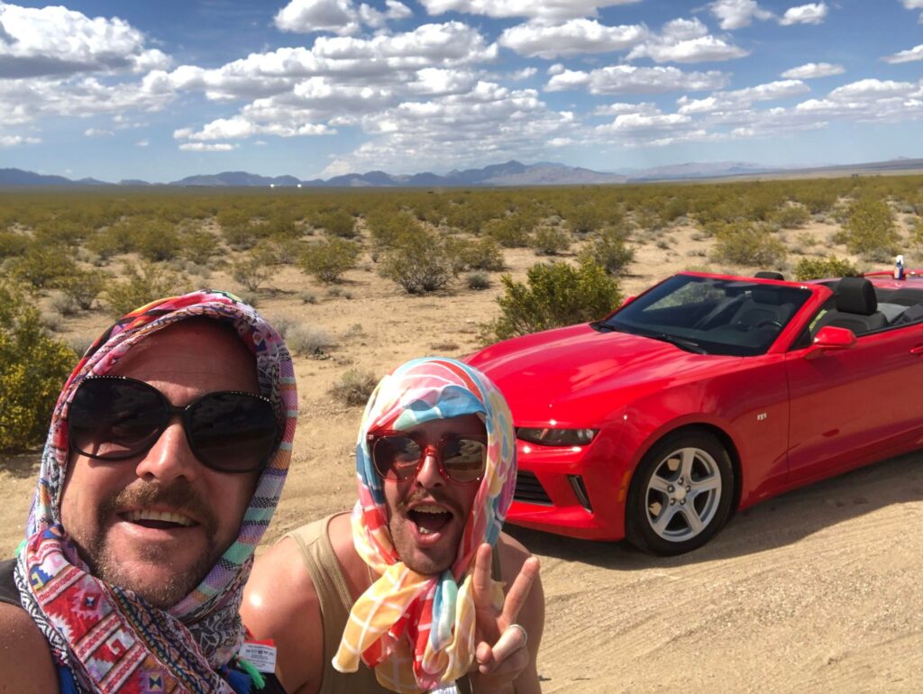 Jason and Liam, also known as Thelma and Louise, stop for a photo while driving from Las Vegas to Palm Springs. (Photo Credit: Jason Smith / GuysAdventures)