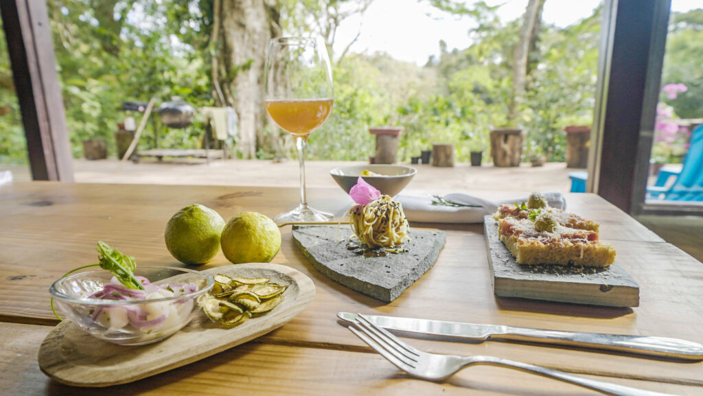 A glass of wine accompanies vegan chayote ceviche and other dishes served at Chef Rolando Chamorro's restaurant at Hacienda Mamecillo, Boquete, Panama. (Photo Credit: National Geographic for Disney/Missy Bania)
