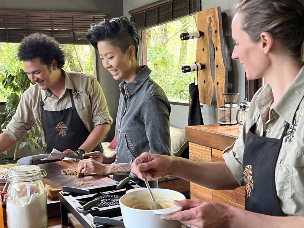 Chef Kristen Kish cooks with Chef Rolando Chamorro and his wife Gabriella Carlsson at their restaurant in Hacienda Mamecillo, Boquete, Panama. (Photo Credit: National Geographic for Disney/Missy Bania)