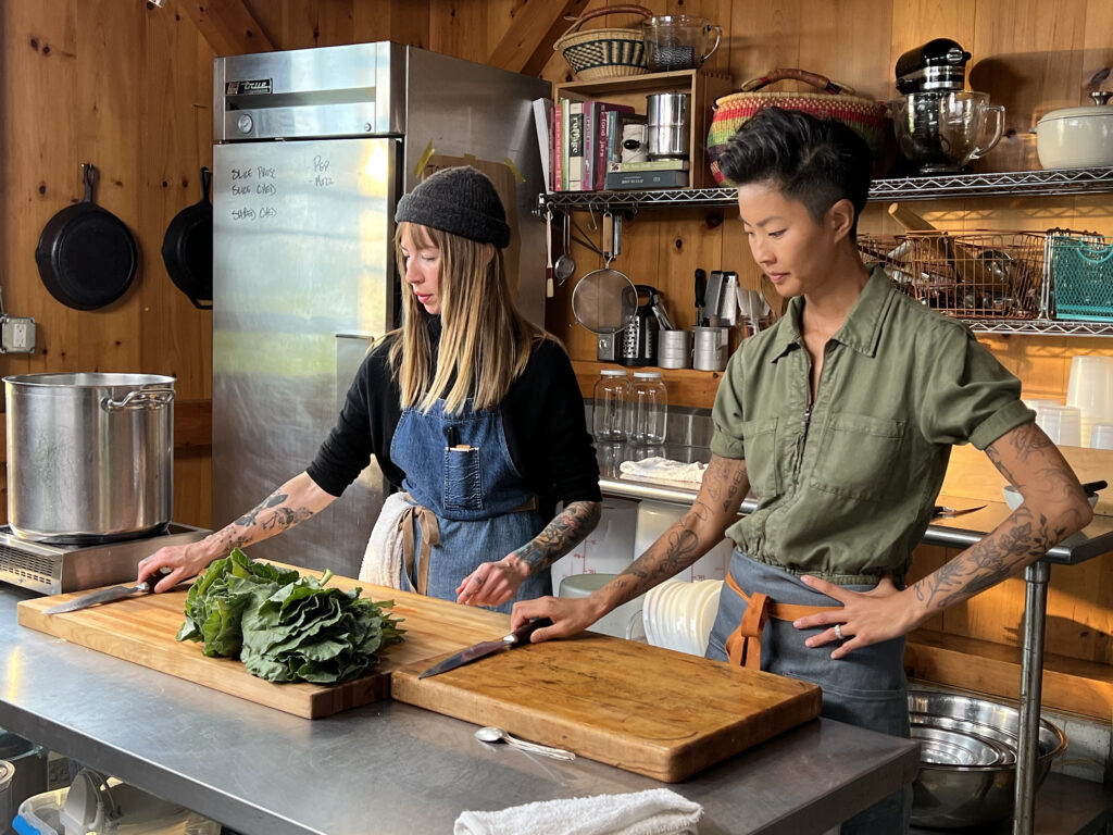 Chefs Carolynn Ladd and Kristen Kish get ready to cook together in the kitchen at Ladd's restaurant in North Haven, Maine. (Photo Credit: National Geographic/Missy Bania)
