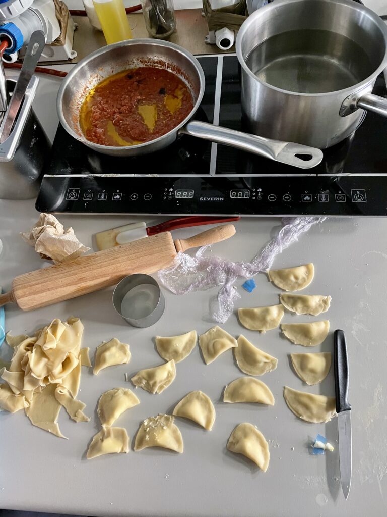 Cooking traditional ravul in tomato sauce at the Mediterranean Culinary Academy. (Photo Credit: Andrew Okwuosah)