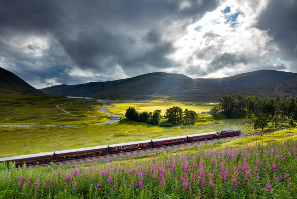 The Royal Scotsman on the line from Perth to Inverness at Dalnaspidal, near Dalwhinnie, Badenoch and Strathspey, Scotland (Photo Credit: Belmond)