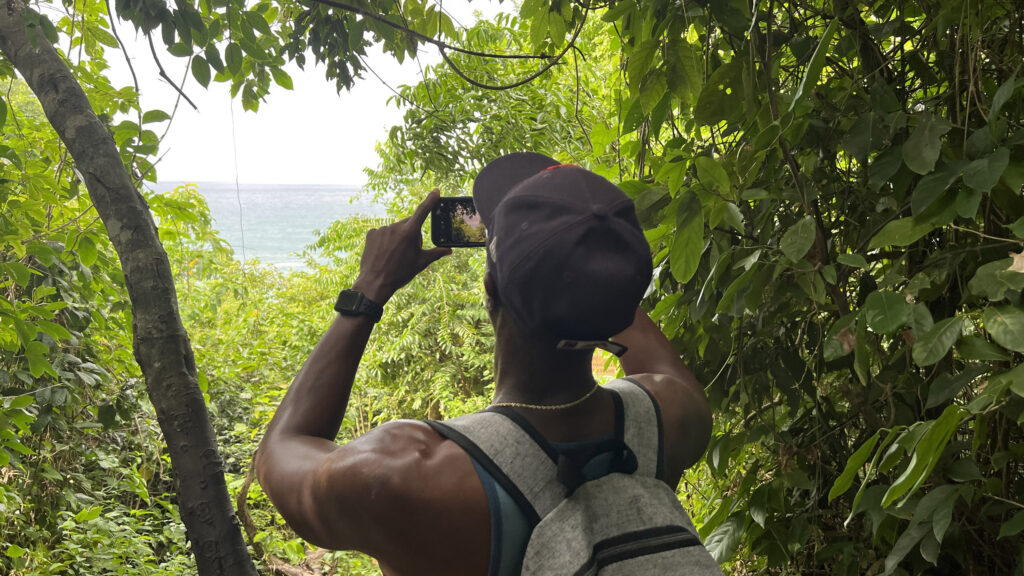 Henry's husband stop during their hike to take a photo in Tayrona National Park. (Photo Credit: Paul J. Heney)