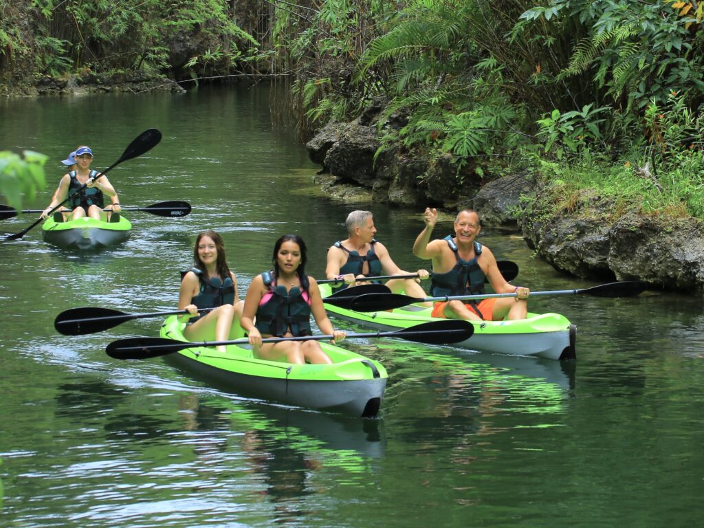 Jon and his family kayaking through the Ha Cenote. (Photo Credit: Jon Bailey)