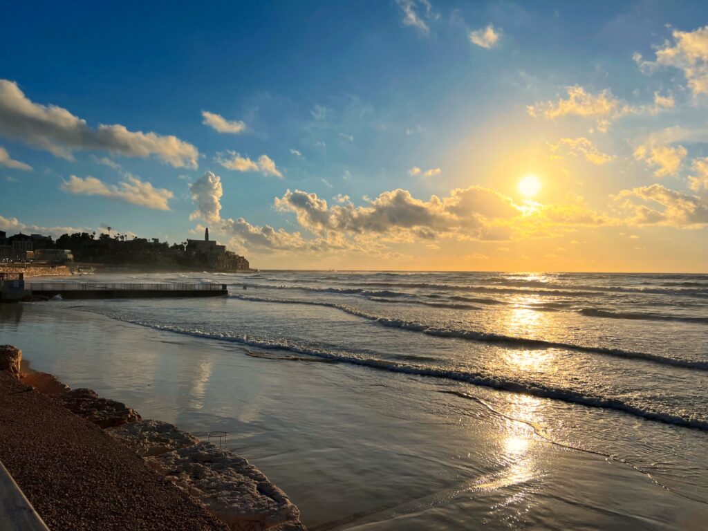 Tel Aviv beach with Old Jaffa at a distance (Photo Credit: Malachi Demmin-De Lise)
