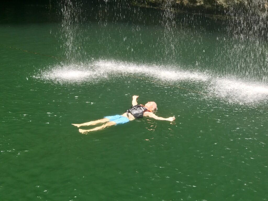 Jon floating in Cenote Ik Kil near Chichen Itza (Photo Credit: Jon Bailey)